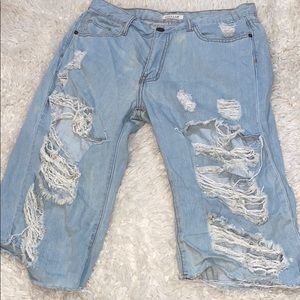 Blue denim ripped to the knee shorts